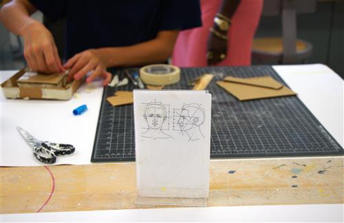 Student making art in Creative Expressions Camp